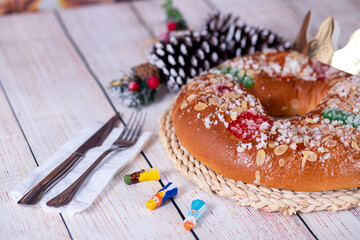 Epiphany cake, Kings cake, Roscon de reyes or Rosca de reyes on wooden table.
