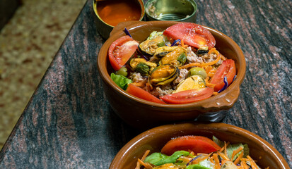 Salad with vegetables and canned mussesls and tuna.