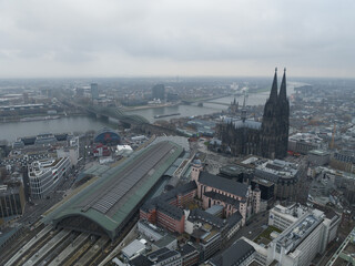 Aerial view of downtown Cologne city center. River rhine, skyline, Cologne Cathedral and the Hohenzollernbrucke. Train station and infrastructure.