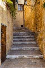 stony staircase in Tuscany, surrounded by stony walls