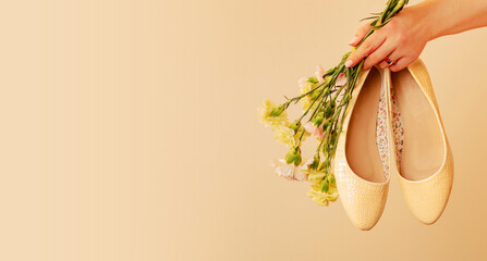 Fashion banner - spring footwear for woman. Pastel yellow ballet flats shoes (ballerinas).