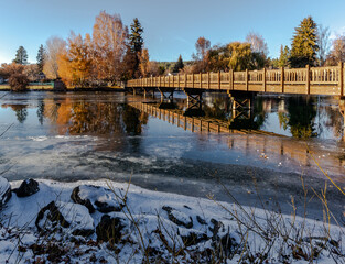 Drake Park Bridge overlooking the Mirror Pond in Bend, Oregon, on a beautiful late autumn, early winter afternoon.