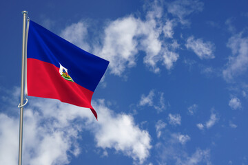 Republic of Haiti flags over blue sky background. 3D illustration