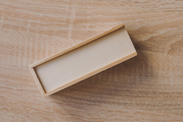 Dominoes in a wooden box on the table