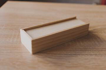 Dominoes in a wooden box on the table