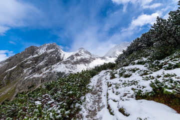 Fototapeta na wymiar snow covered hiking path during spring (Tyrol, Austria)