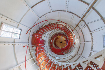 Iron spiral staircase inside the old lighthouse, top view