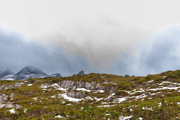 wooden cross on a cloudy day in the alps (L&uuml;nersee, Vorarlberg, Austria)