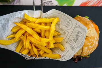 French fried potatoes in newsprint