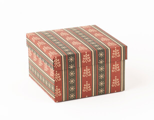 Christmas gift box isolated on white background. Patterned craft paper box.