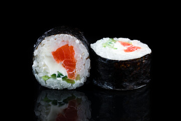 Japanese kitchen maki sushi rolls with salmon, cream cheese and cucumber.