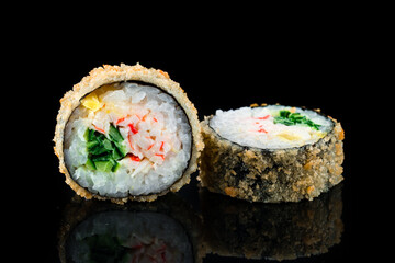 Tempura sushi rolls with crab sticks, cucumber and mango.