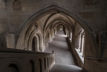 Aisle of a historic monastery.