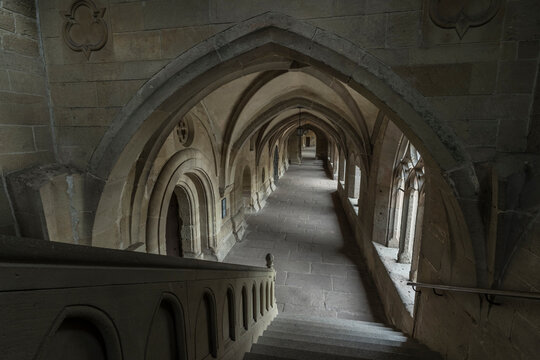 Aisle of a historic monastery.