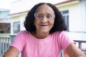 Happy senior brazilian woman smiling