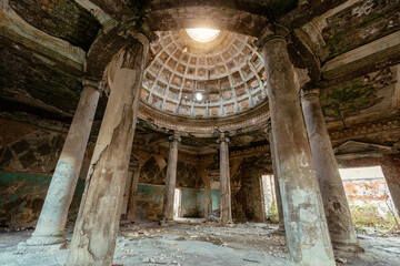 Interior of old ruined palace with columns and dome