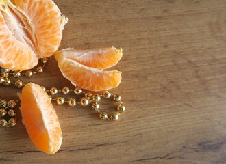 Tangerine slices on a wooden table