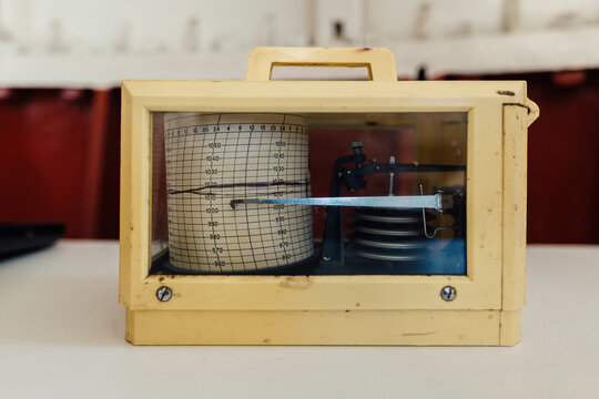 Old vintage marine barograph in plastic box