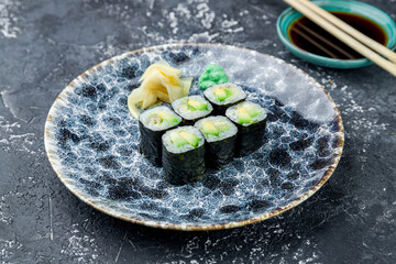 roll avocado Maki on a grey table