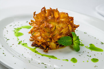 Fried artichoke on a white plate macro close up - 554979712