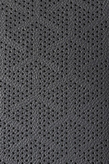 Perforated black leather background