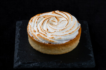 French food fresh lemon tart with seared meringue.