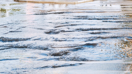 Streams through the streets of the city after a heavy rain.