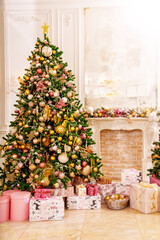 A large beautiful traditional Christmas tree with gifts in a classic interior.
