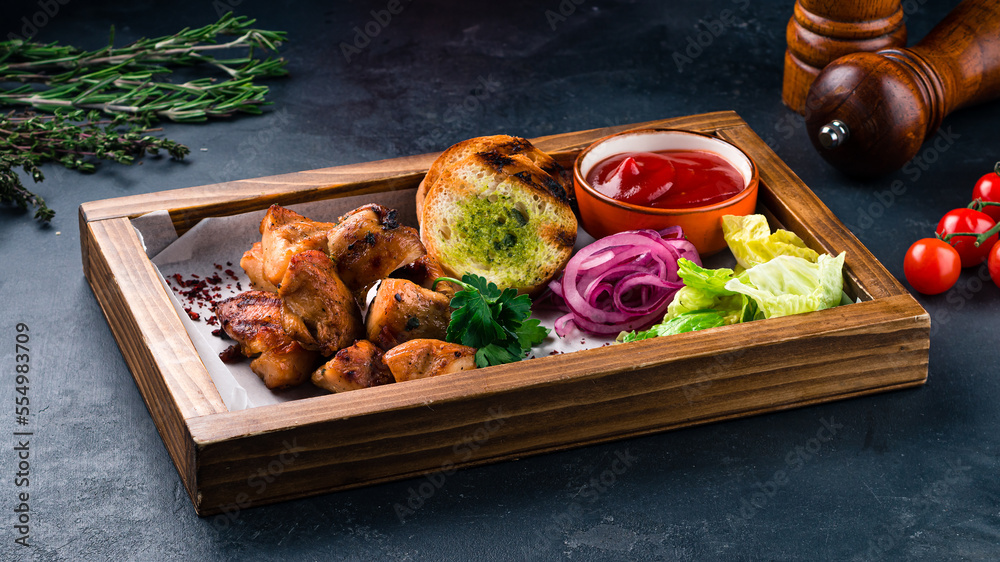 Canvas Prints Grilled chicken fillet with marinated red onion, romaine lettuce, croutons and ketchup.