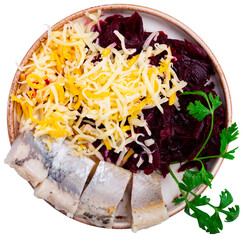Portion of grated beetroot served with cheese and pickled mackerel fish. Isolated over white...