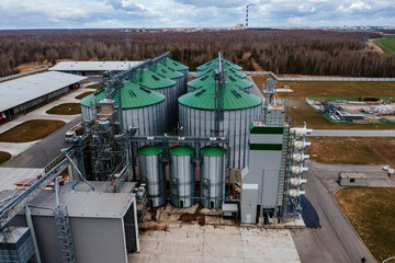Automatic agricultural grain dryer and silos, aerial view. Modern complex for drying, cleaning and storage grain