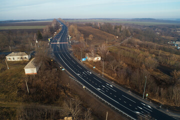 Aerial view asphalt road and green forest, Forest road going through forest with car adventure view from above, Ecosystem and ecology healthy environment concepts and background.