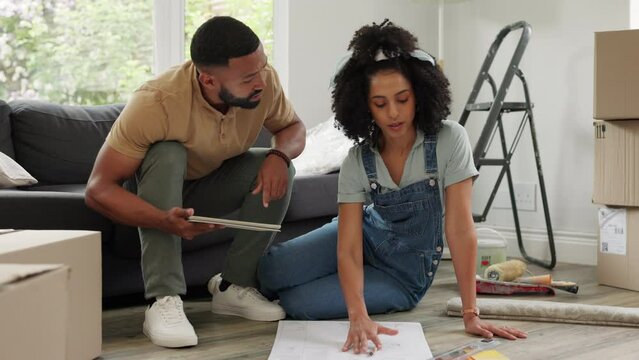 Home renovation, construction and couple designing plan of house with digital tablet, color options and blueprint of new property. Architecture, real estate and working on home improvement together