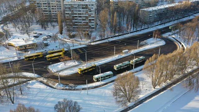 Terminal Station For Trolleybuses And Buses. Trolleybus Depot In Winter. Yellow Bus. Public Electric Urban Transport In Winter. Frozen Buses.