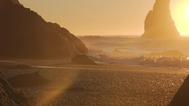 Black Sand Beach In Iceland, Sunset over Volcanic Cliffside, North Atlantic Ocean Water, Vik, Shot in 8K Resolution 4320p
