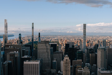 A bird's eye night view of New York City's skyscrapers and apartment buildings. Aerials view of Manhattan from the Empire State Building 