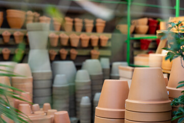 Showcase of home decor shop with various ceramic flower pots for sale