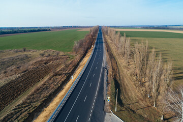 Aerial view asphalt road and green forest, Forest road going through forest with car adventure view from above, Ecosystem and ecology healthy environment concepts and background.