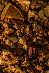 Texture of herbal tea with gingerbread, spices and dehydrated orange