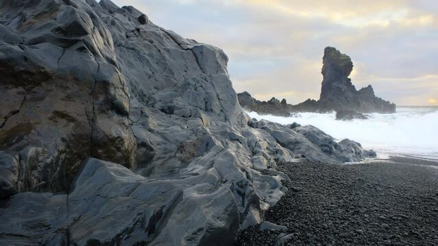 Icelandic Black Sand Coast at Sunset, Volcanic Cliffside with Blue North Atlantic Ocean Water, Shot in 8K Resolution 4320p