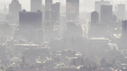 Animation of red abstract pattern over aerial view of city in background - Powered by Adobe