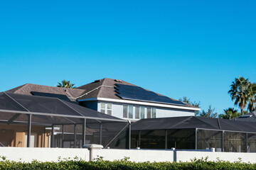 Naklejka premium Solar panel on a house roof; Green energy from sun 
