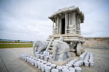 A wide shot of an ancient elephant chariot and pagoda shot in an ancient marble temple in India,...