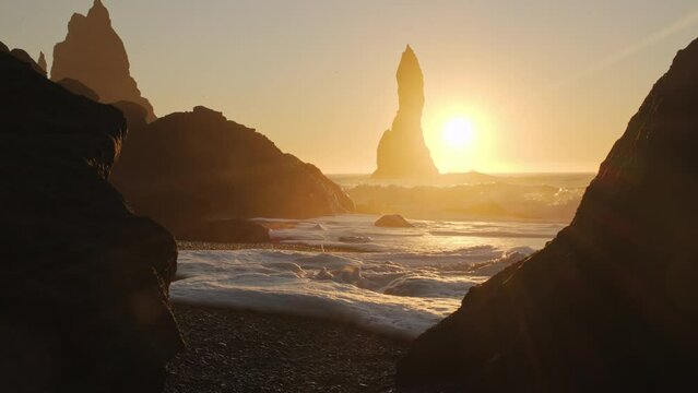 Black Sand Beach In Iceland, Sunset over Volcanic Cliffside, North Atlantic Ocean Water, Vik, Shot in 8K Resolution 4320p