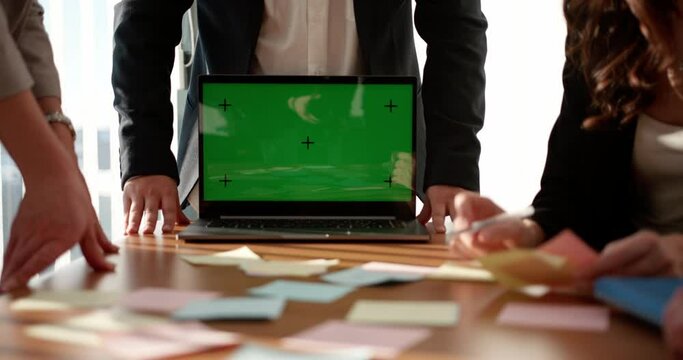 A close-up of the monitor in the office at the meeting is a green screen. the boss shows something on the screen, enters data into the database. Chromakey.
