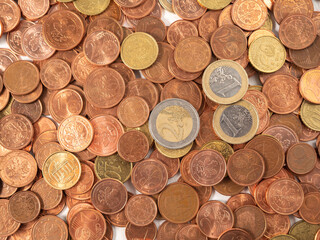 Lots of metal coins. A bunch of euro cents.