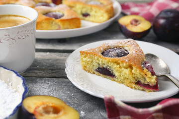Homemade plum pie and cup of coffee. New York Times recipe plum cake