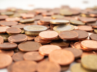 Lots of metal coins. A bunch of euro cents.