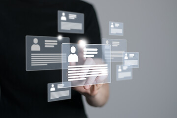 Fototapeta premium Woman`s hand pointing on highlighted cv cards with candidates information. Human resources concept.Illustrative material for articles and web.