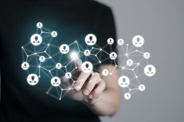 Human resources manager pointing at virtual network chain with person icons. Human capital and teambuilding concept.